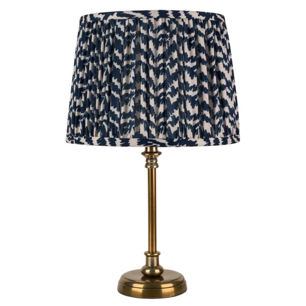 small antique brass stick lamp with Ikat shade
